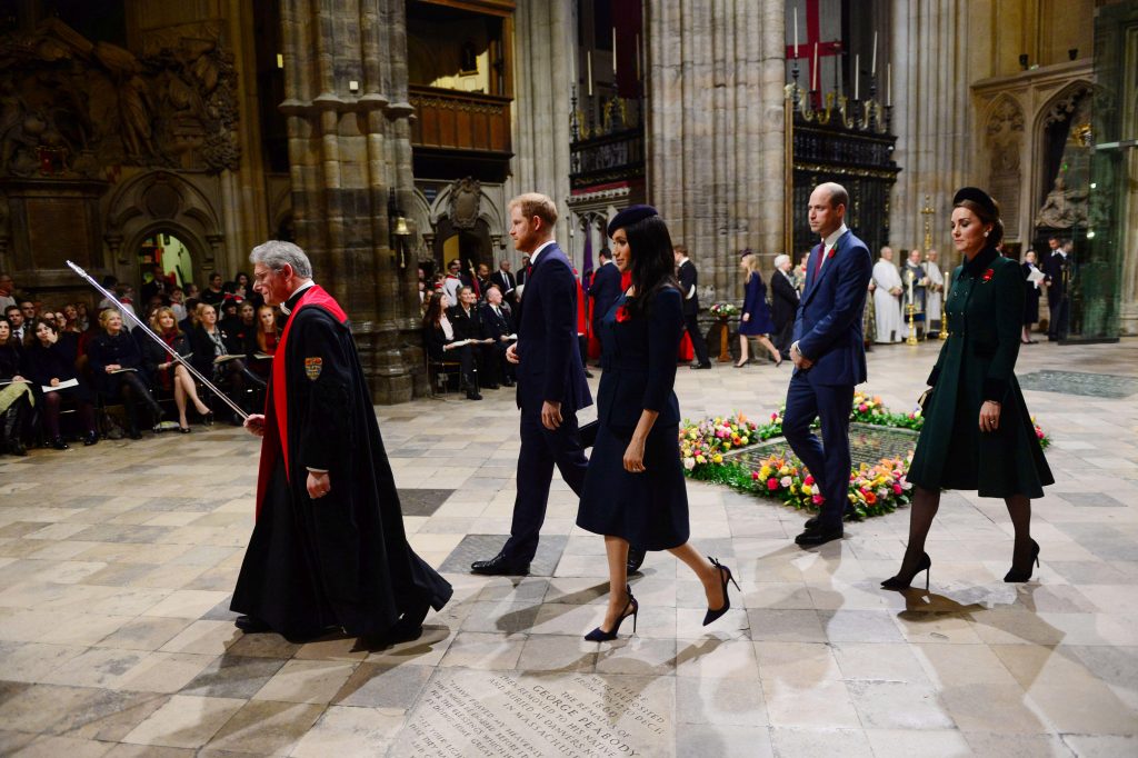 Meghan Markle, Prince Harry Prince William and Kate Middleton alongside walking by the grave of "An Unknown British Soldier"